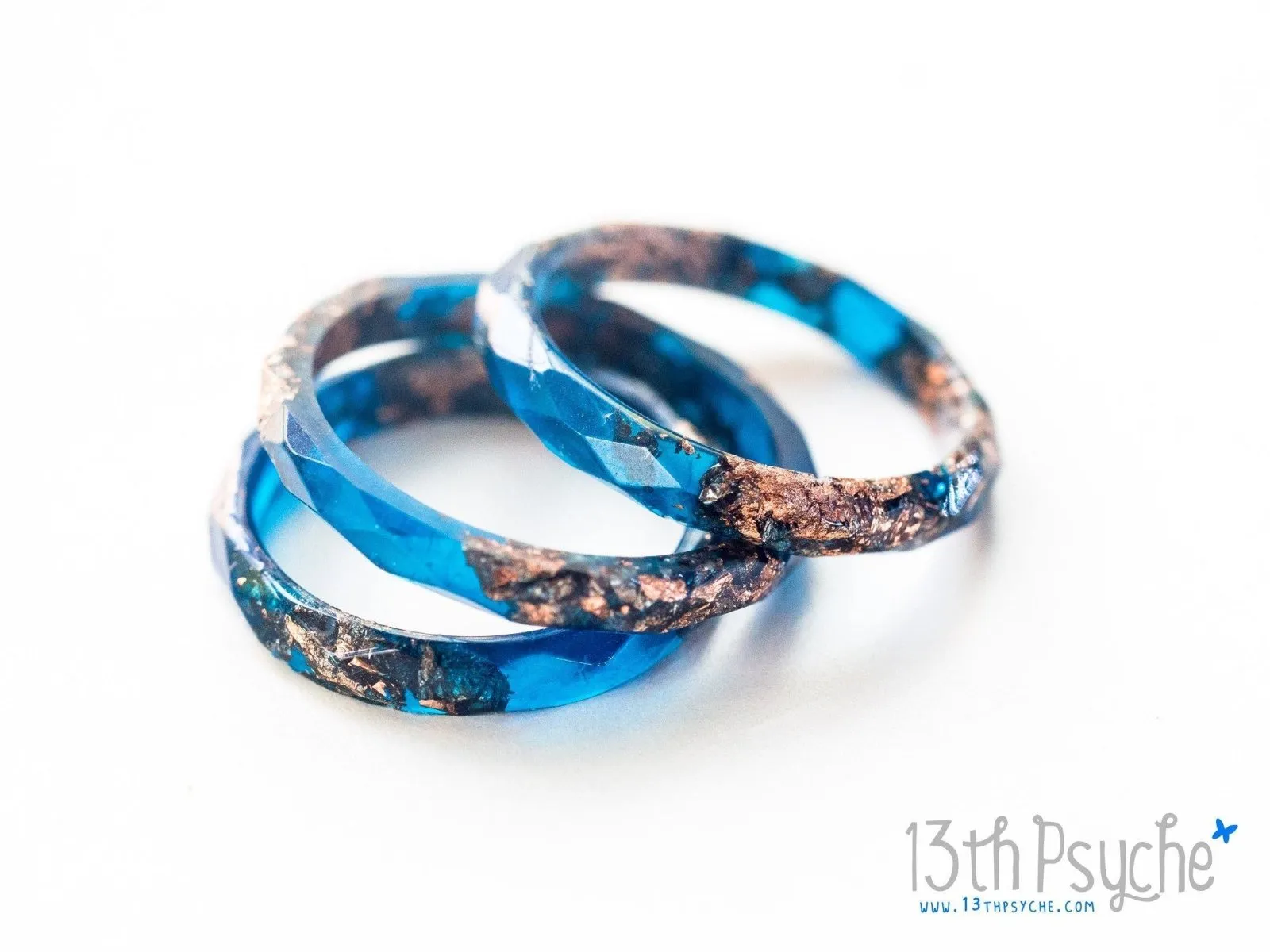 Dark blue and rose gold flakes faceted resin ring