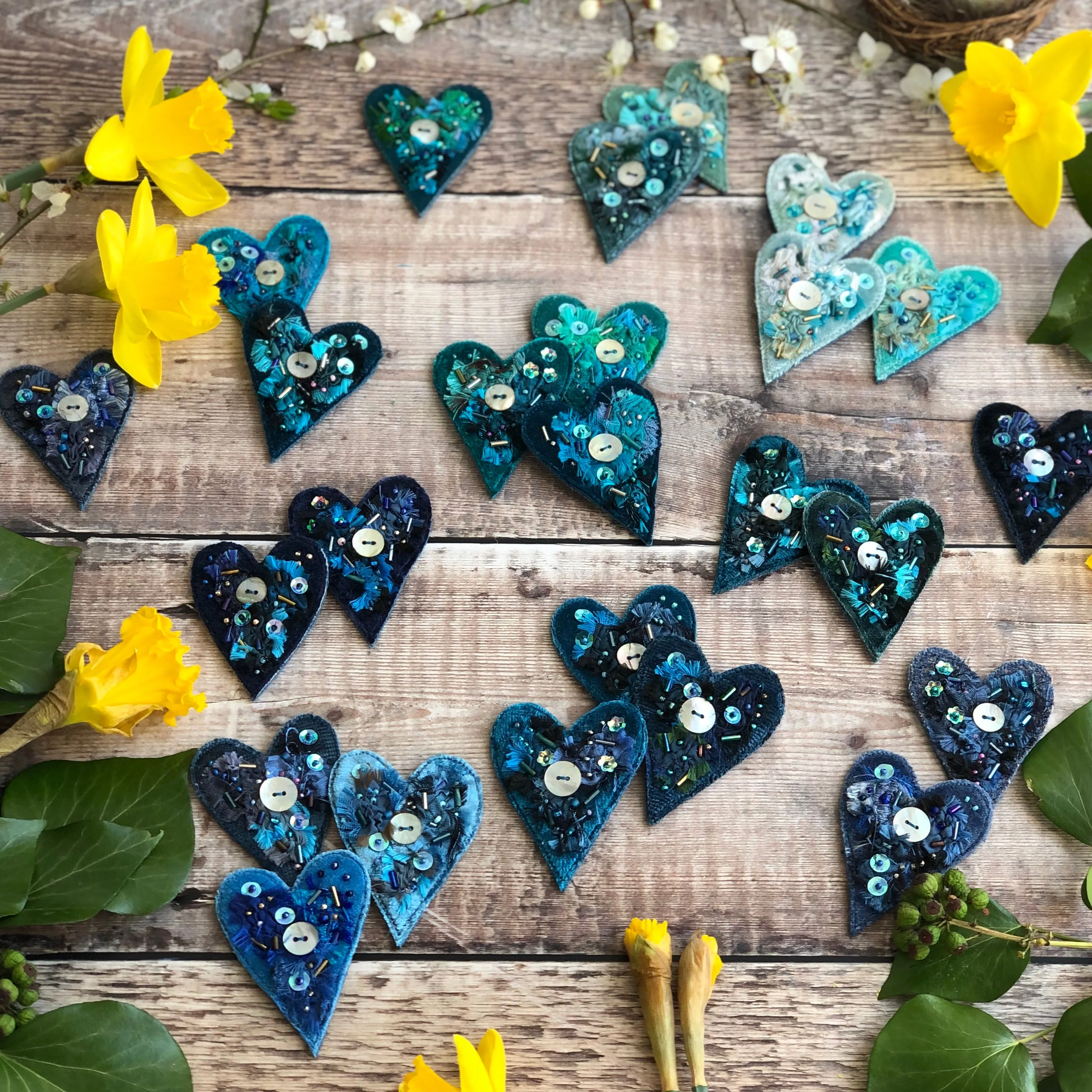 Fabric heart brooches in blues