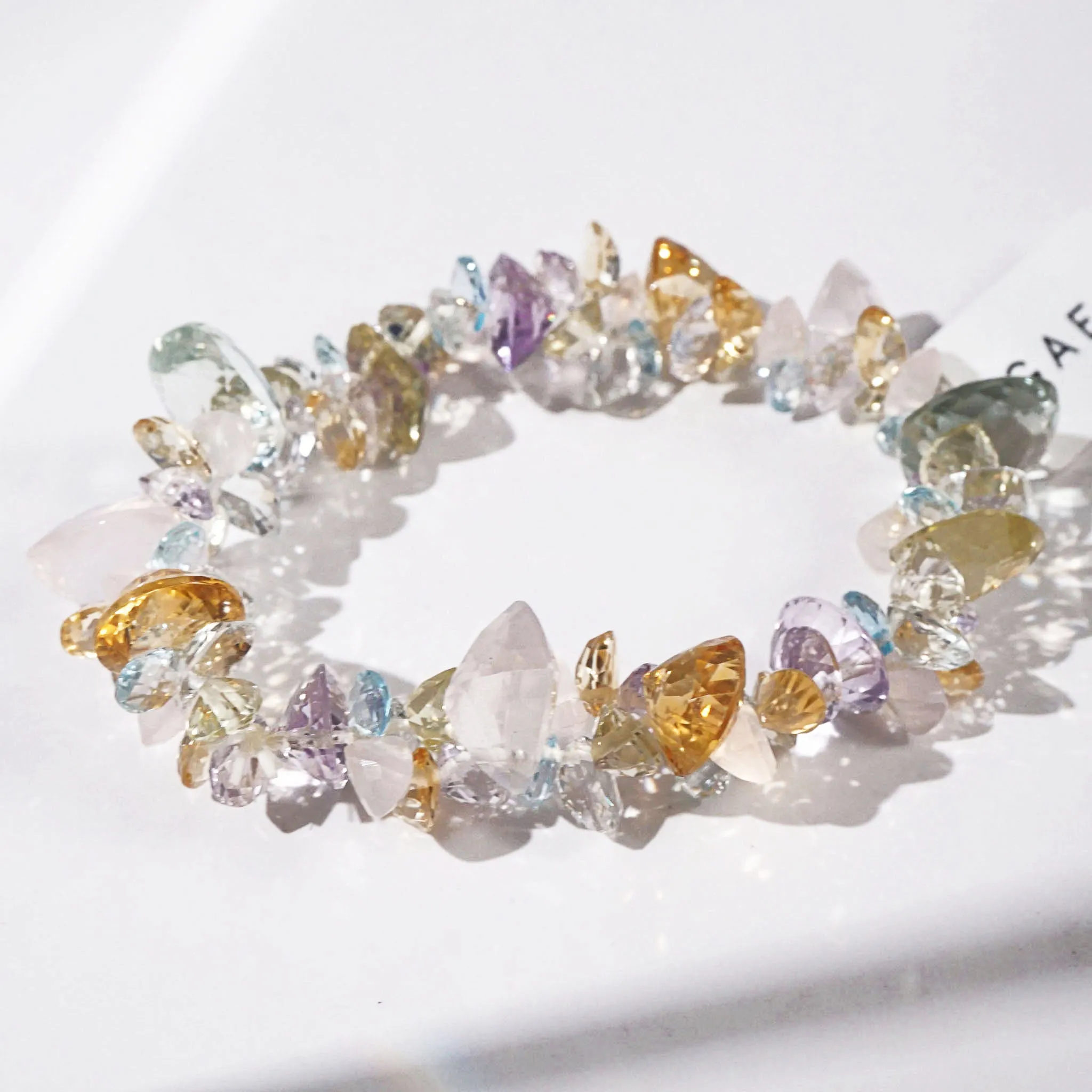 Gem-Grade Rose Quartz, Amethyst, Citrine, Prasiolite, Blue Topaz Briolette