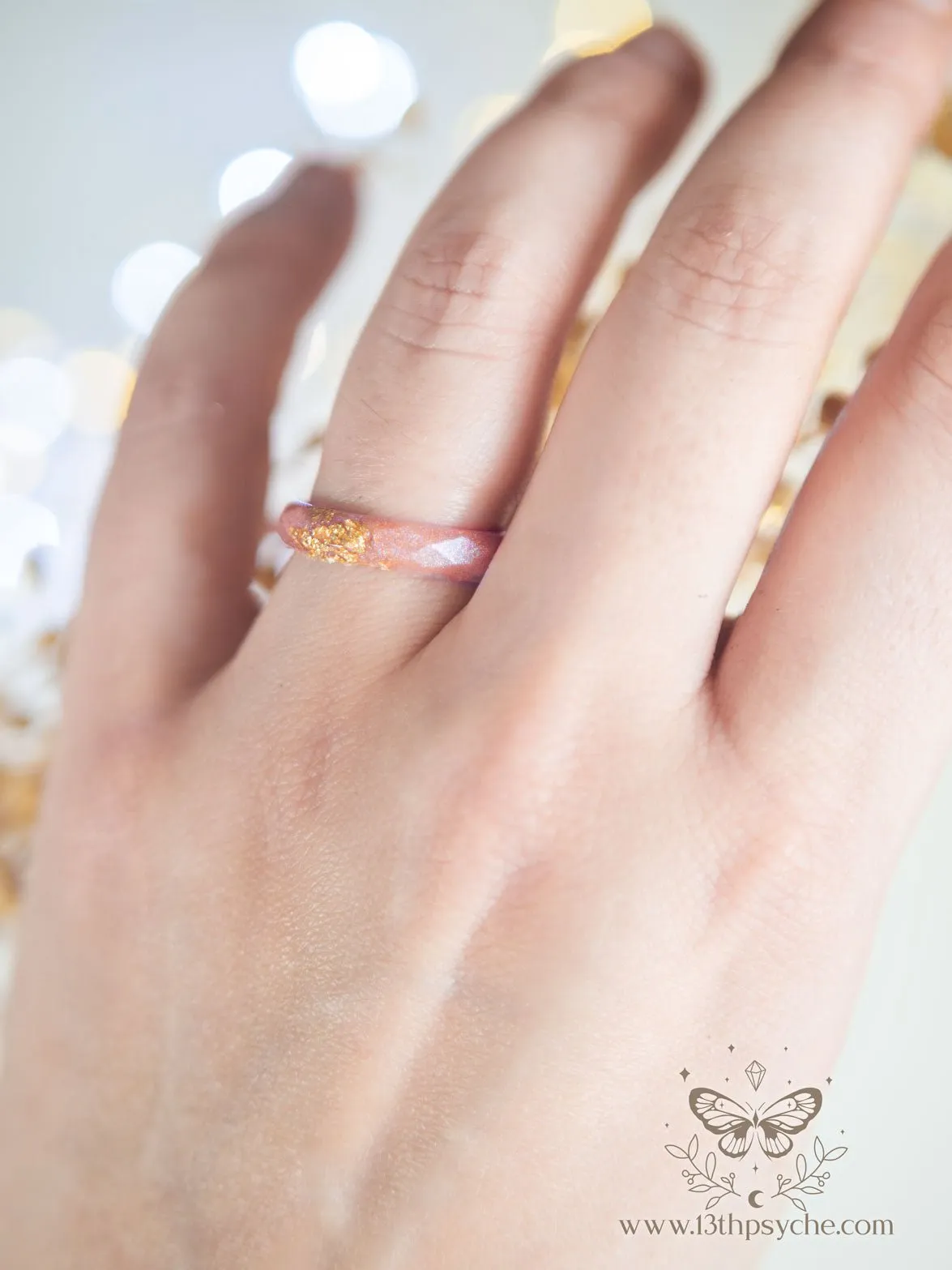 Iridescent pink faceted resin ring with gold metal flakes